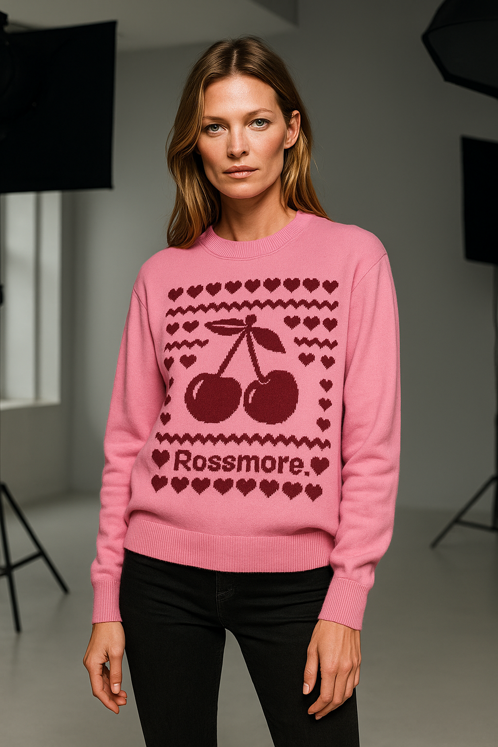 runway model wearing ROSSMORE jacquard cherry baby sweater